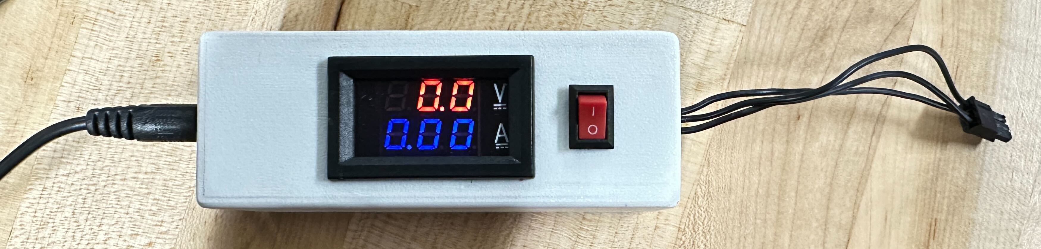 The custom powered torpedo charger with a display showing voltage and charging current